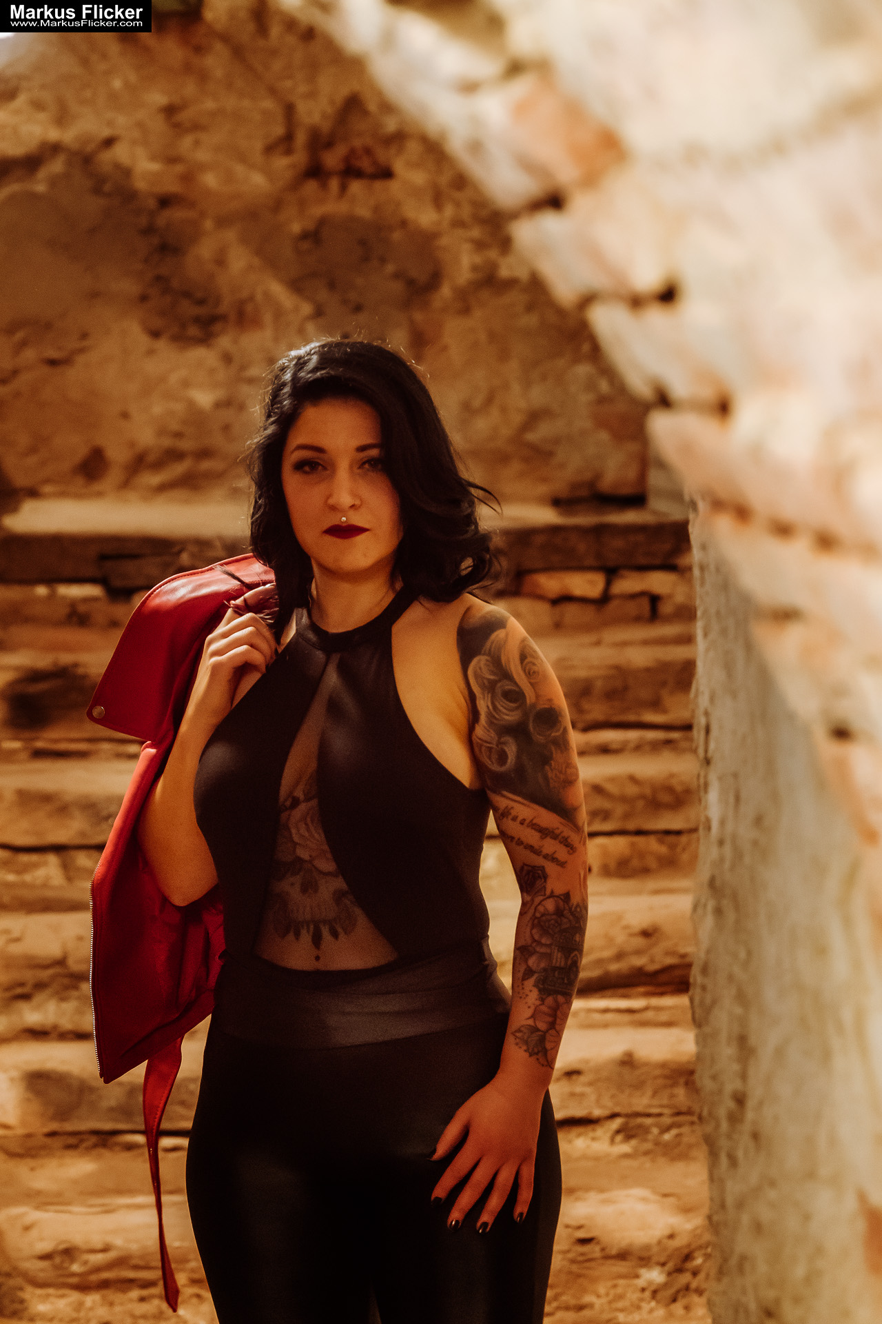 Red Jacket Underground Keller Gewölbe Portrait Photography Female Tattoo Model Elisa in Graz