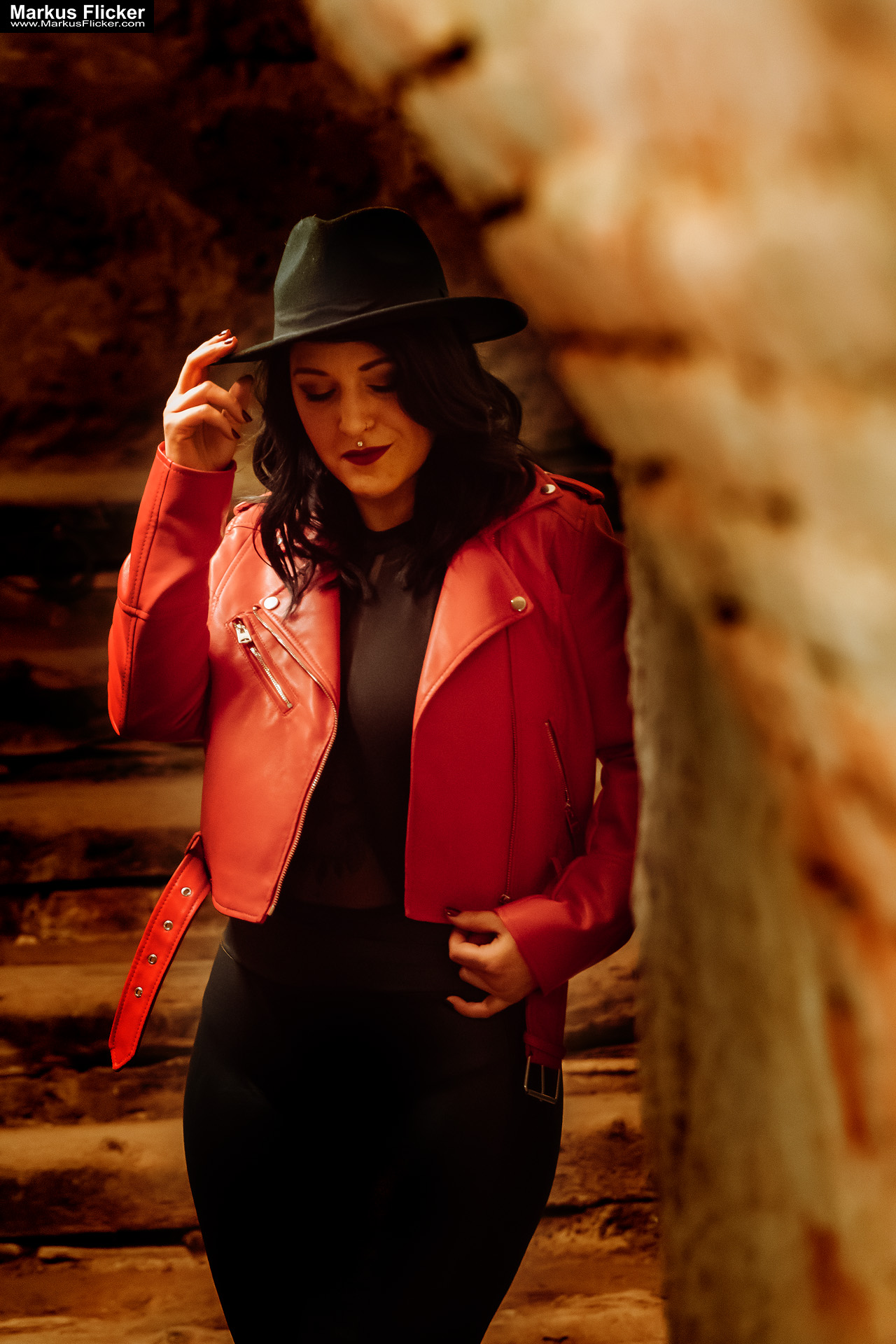 Red Jacket Underground Keller Gewölbe Portrait Photography Female Tattoo Model Elisa in Graz